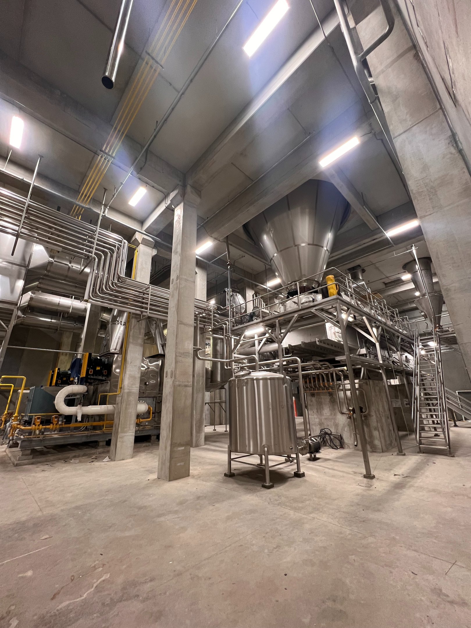 Large food-grade production system with stainless piping and process equipment